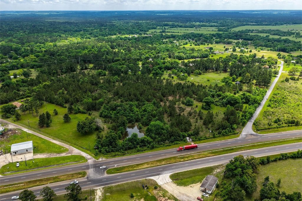 Aerial showing Hwy 19 frontage with traffic